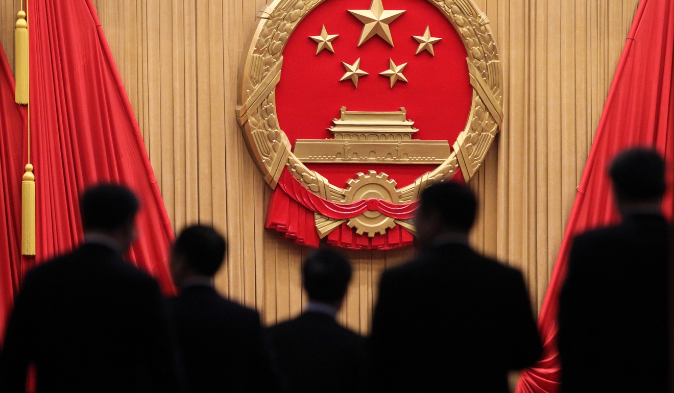 NPC deputies enter the hall for Sunday afternoon’s vote on revisions to China’s constitution. Photo: Simon Song