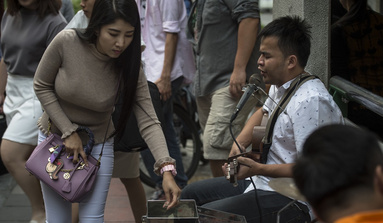 I’m just doing a job, I don’t look for sympathy, says bling singer Singhkum Boonriang. Photo: AFP