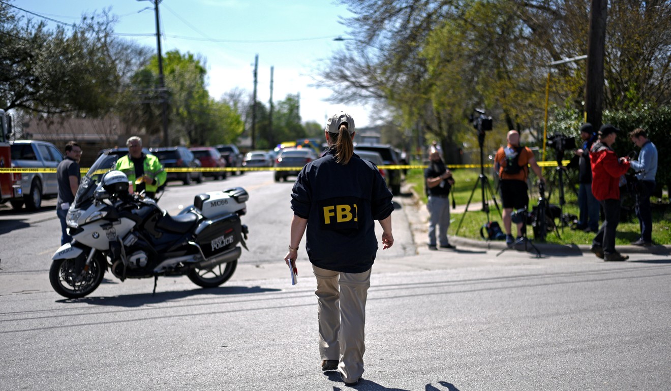 An FBI agent at the scene of an explosion in suburban Austin, Texas. Photo: Reuters