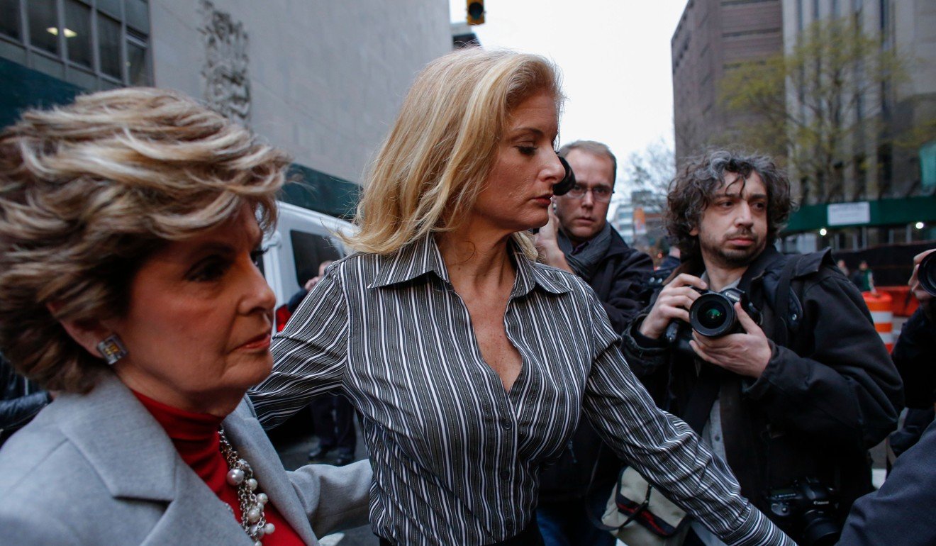 This file photo taken on December 5, 2017 shows Summer Zervos, a former contestant on “The Apprentice” (centre) walking next to her lawyer, Gloria Allred after leaving the New York County Criminal Cour. Photo: Agence France-Presse