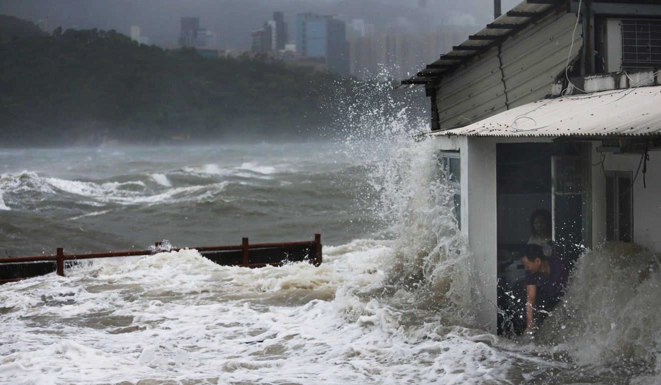 Sam Tsang’s photo of high waves battering the seaside homes of villagers in Lei Yue Mun was second in the Spot News category. Photo: Sam Tsang