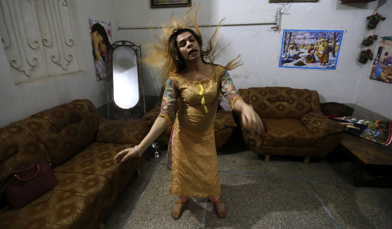 Lovely (pseudonym), a Pakistani transgender woman, dances at her home in Peshawar, Pakistan, on March 14. Photo: EPA-EFE