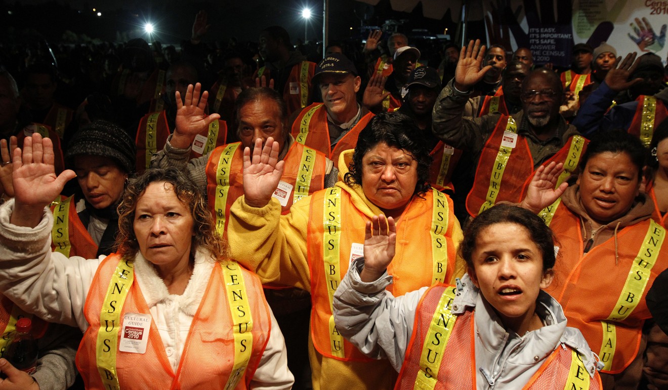 Census Bureau workers take an oath at Dodger Stadium in Los Angeles, California, on March 30, 2010. Millions of foreign-born residents are expected to hide from or avoid the 2020 count because of the political climate created by US President Donald Trump, census staff and civil-rights groups have said. Photo: Los Angeles Times via TNS