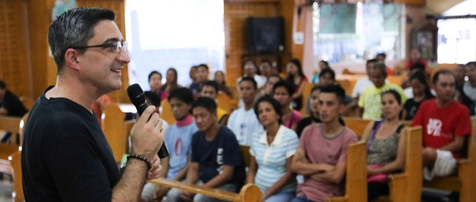 Father Luciano Felloni at a meeting of the Community Assisted Rehabilitation and Recovery of Outpatient Training System (Carrots), a programme that mixes psychology, counselling and spiritual guidance to get people off drugs. Photo: Carrots