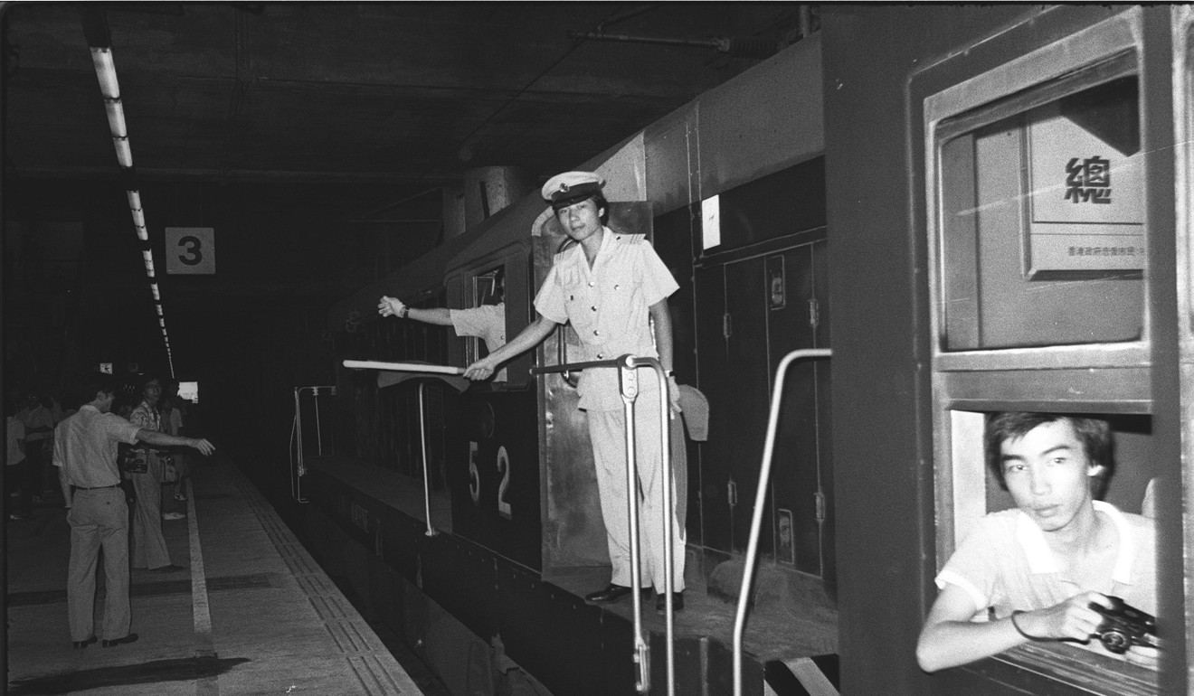 A Kowloon-Canton Railway Corporation employee waves a traditional green flag on the last diesel-driven train at Hung Hom Station. The government was seeking ways to electrify the railway 40 years ago. Photo: SCMP Archive