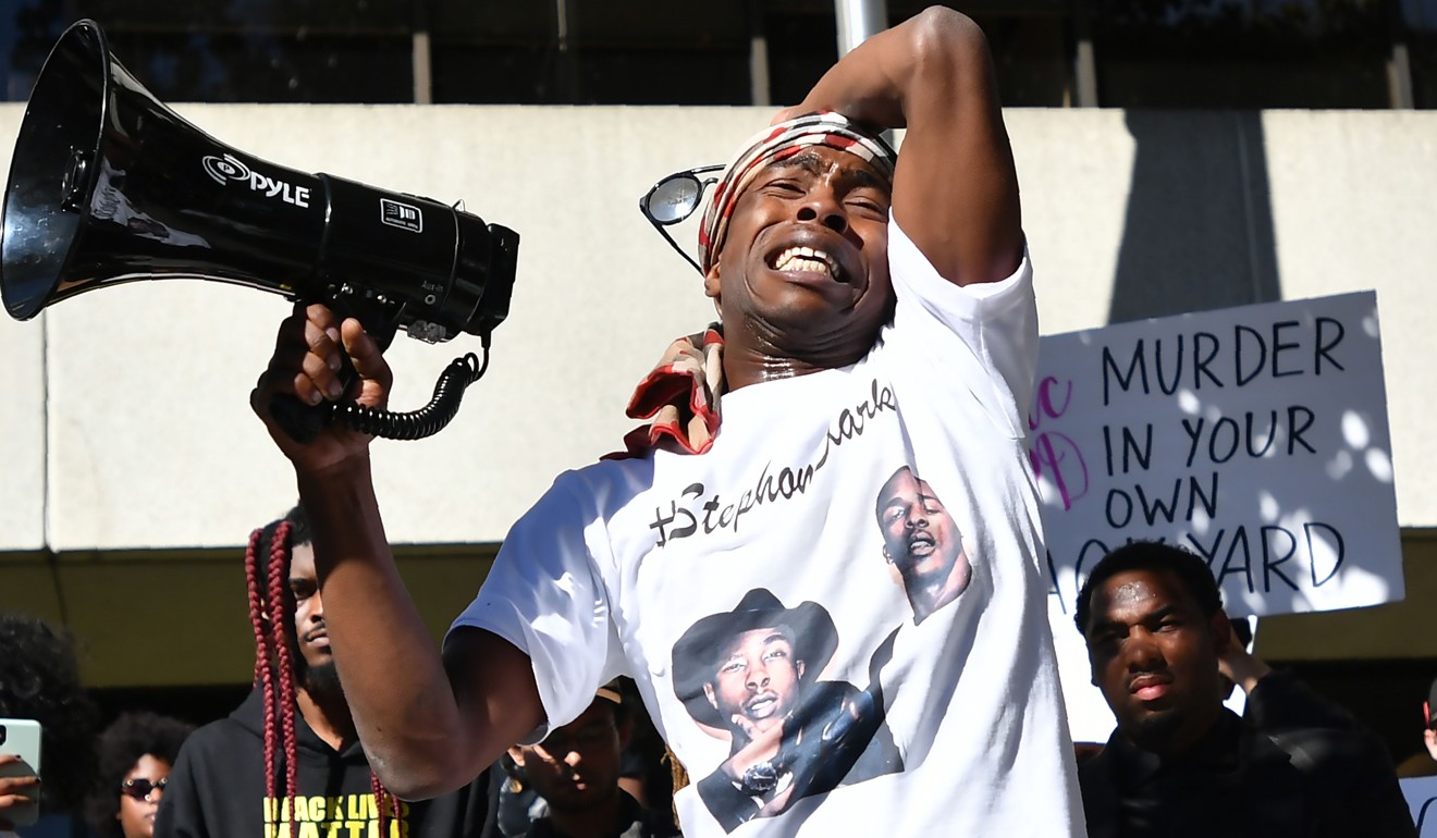 Stevante Clark addresses fellow protesters Wednesday in response to the police shooting of his brother, Stephon Clark, in Sacramento, California. Photo: AFP 