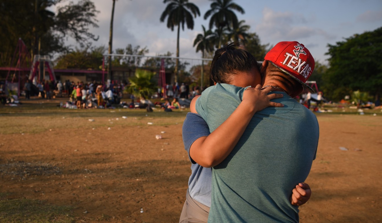 A Central American migrant couple hugs during the ‘Migrant Via Crucis’ caravan as they camp at a sport complex in Matias Romero, Oaxaca state, Mexico, on Wednesday. Photo: AFP 