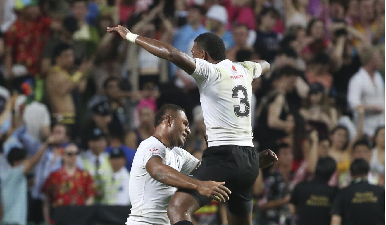 Fiji's Vatemo Ravouvou (L) celebrates with Kalione Nasoko after beating South Africa in the Cup final at the Cathay Pacific/HSBC Hong Kong Sevens 2017. Photo: K.Y, Cheng