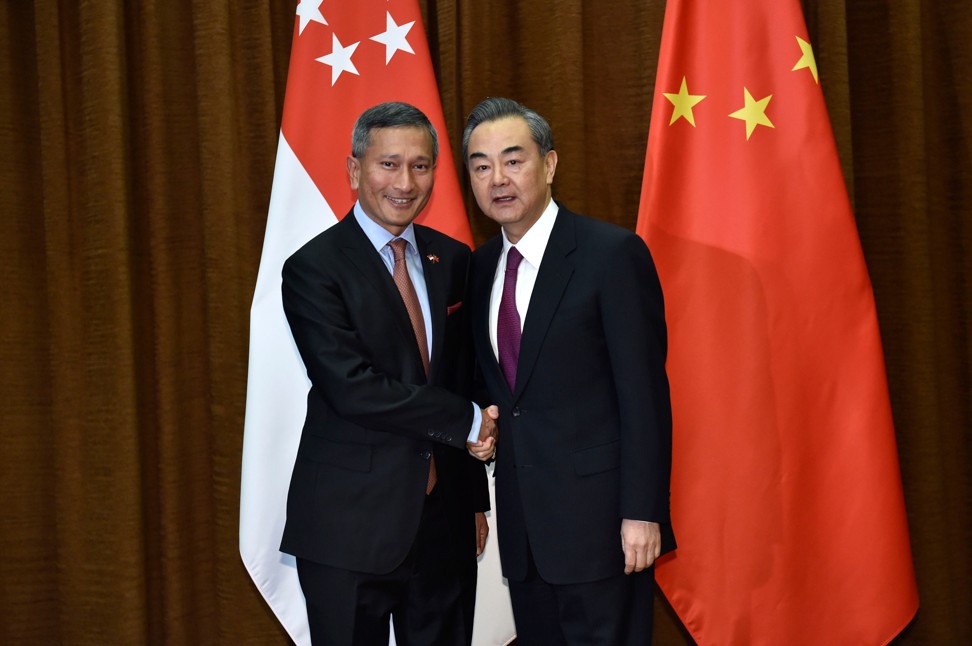 China’s Foreign Minster Wang Yi (right) and Singapore’s Foreign Minister Vivian Balakrishnan agreed to work together to fight protectionism when they met in Beijing on Sunday. Photo: AFP