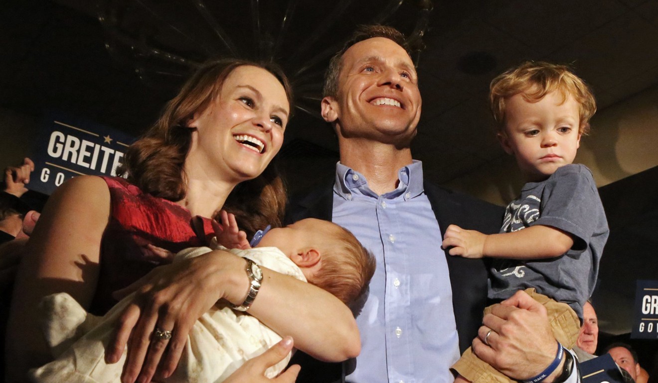 Eric Greitens poses with his wife, Sheena and his two sons Jacob and Joshua. File photo: AP