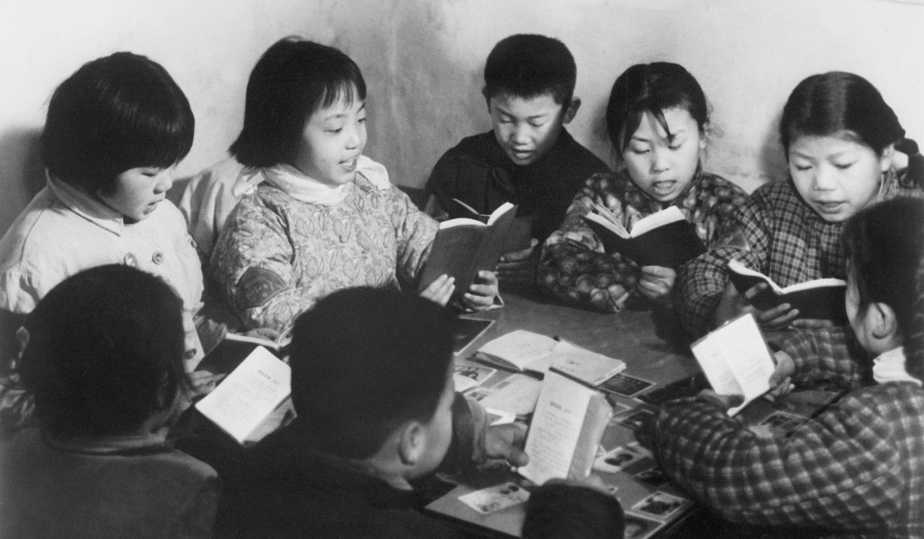 Schoolchildren read copies of Mao Zedong's Little Red Book in July 1968, in Beijing at the height of the Cultural Revolution. Picture: AFP