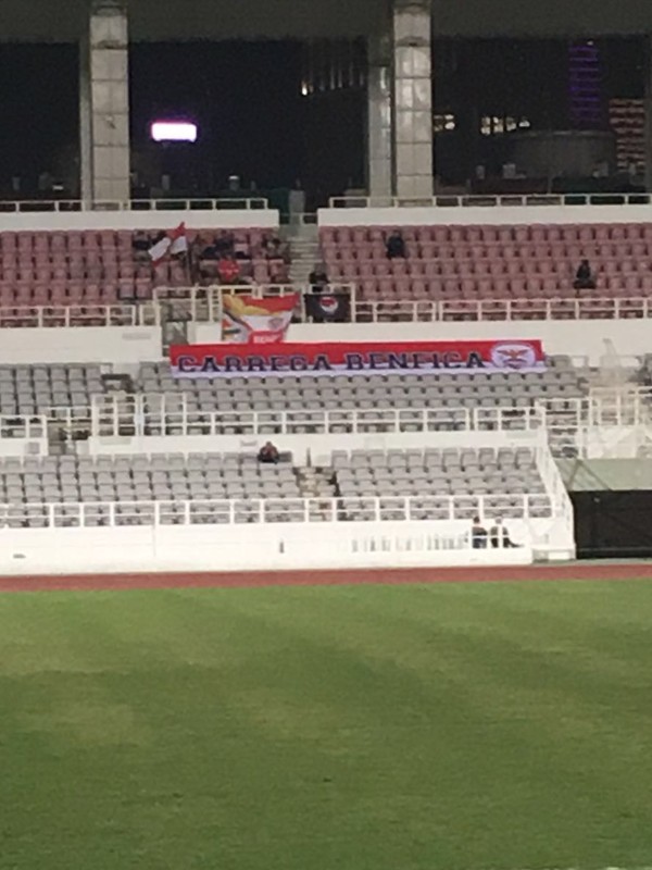The Benfica Macau supporters sat behind their flag. Photo: Jonathan White