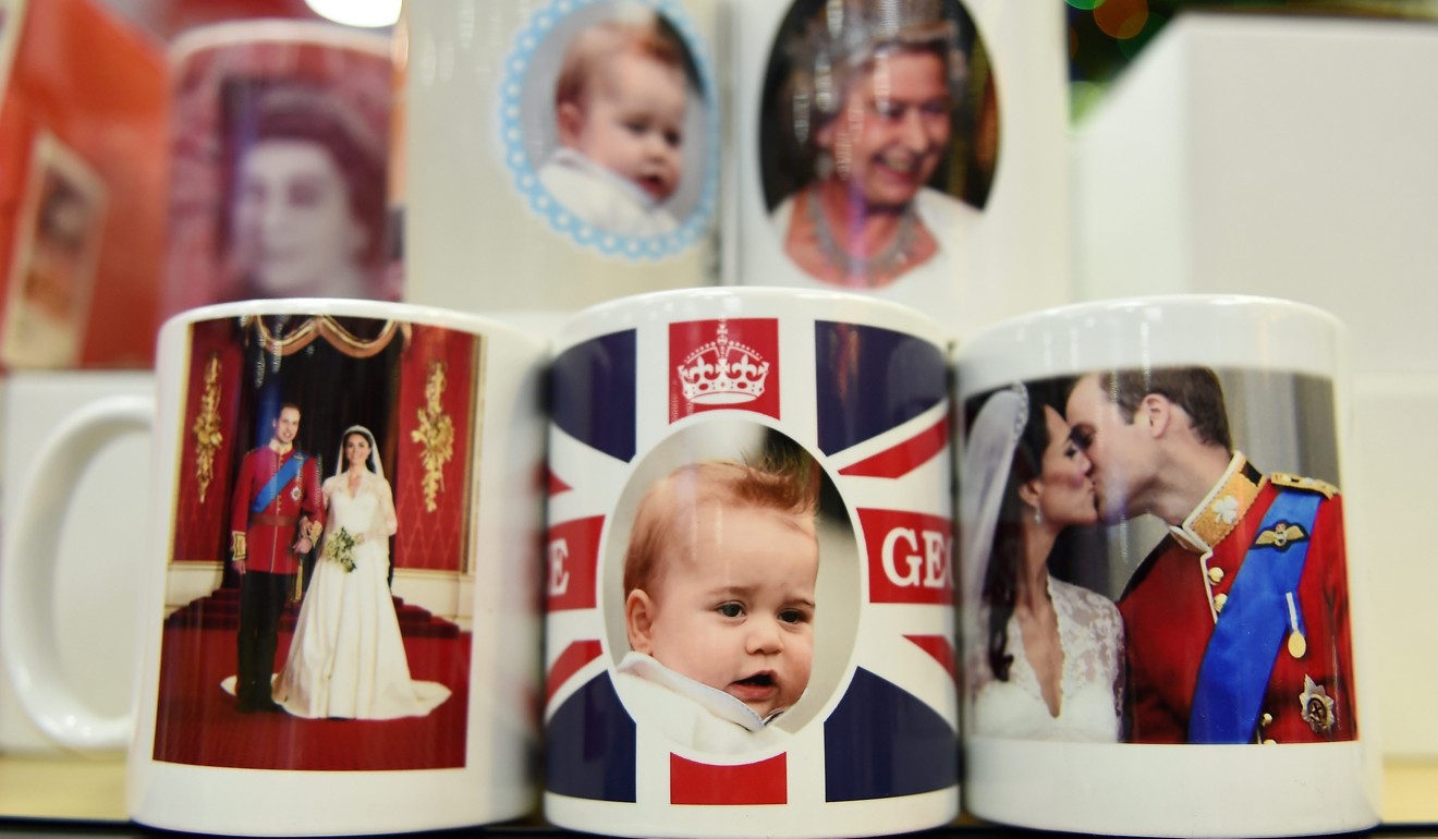 Royal souvenirs of British Prince George, Prince William and Catherine, Duchess of Cambridge, on a shelf at a souvenir shop in London. Photo: EPA