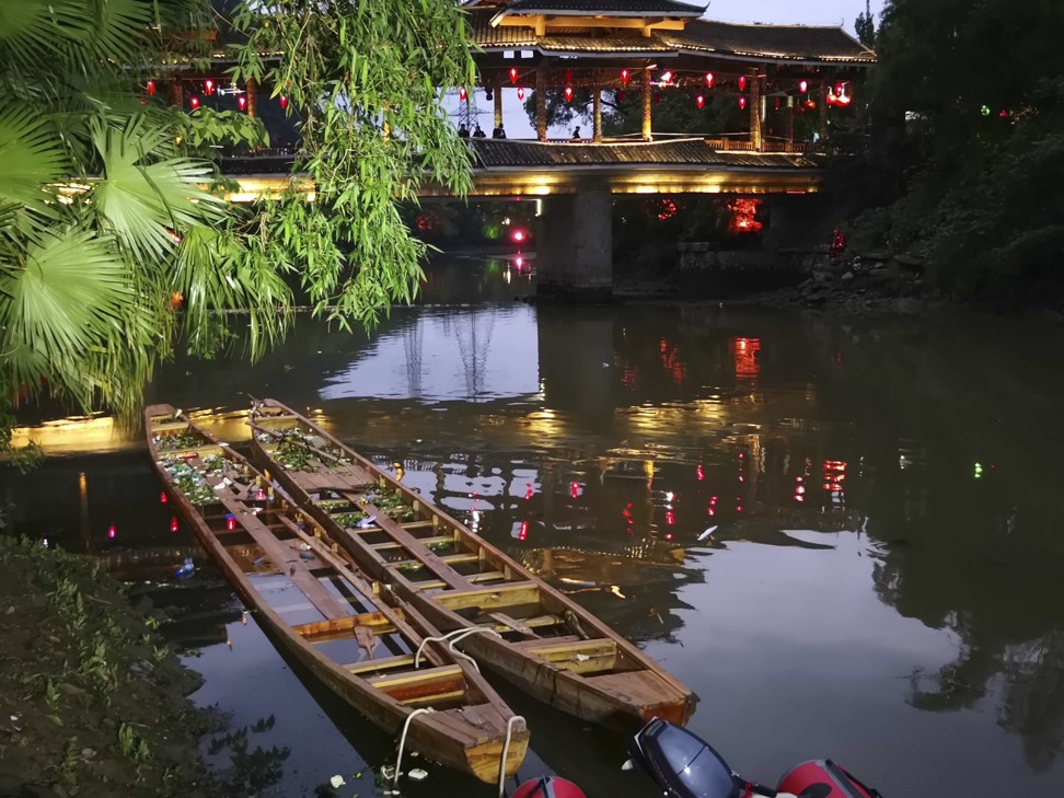 It is not known why the two dragon boats – seen here on the Taohua River – capsized. Photo: Chinatopix via AP