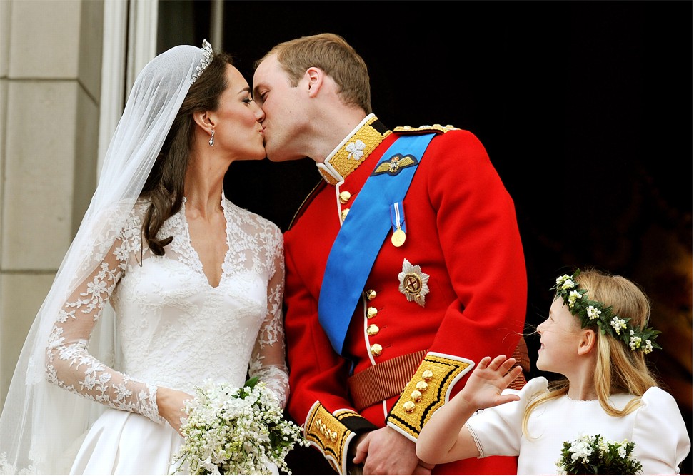Britain's Prince William and his wife Kate, Duchess of Cambridge, kiss on the balcony of Buckingham Palace in London, following their wedding at Westminster Abbey. Photo: AFP
