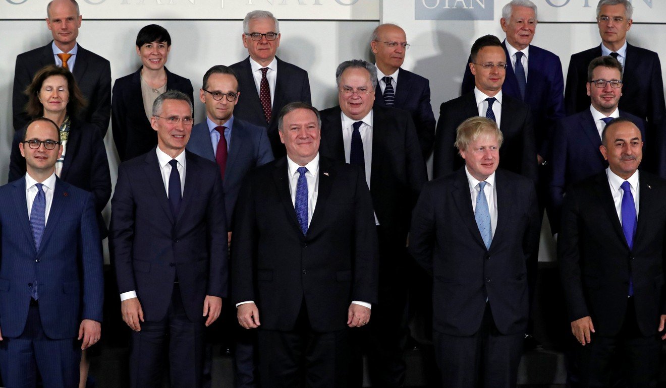 Pompeo with foreign ministers from other member states. Photo: Reuters