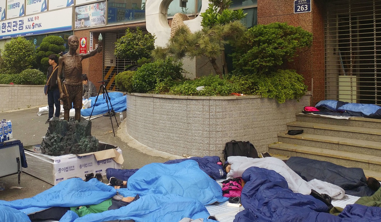 South Korea Clashes As Activists Try To Erect Statue In Honour Of ...