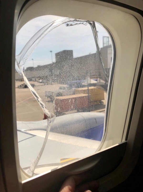 A broken window is seen on Southwest Flight 957, in Cleveland, Ohio on Wednesday. Photo: Reuters/social media