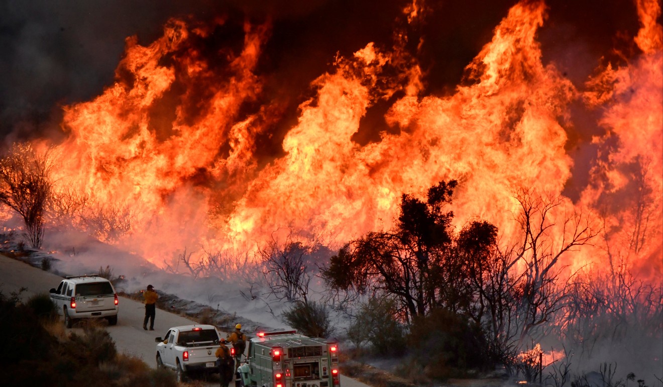 Firefighters fight a massive wildfire north of Los Angeles, California, in December 2017. Picture: Reuters