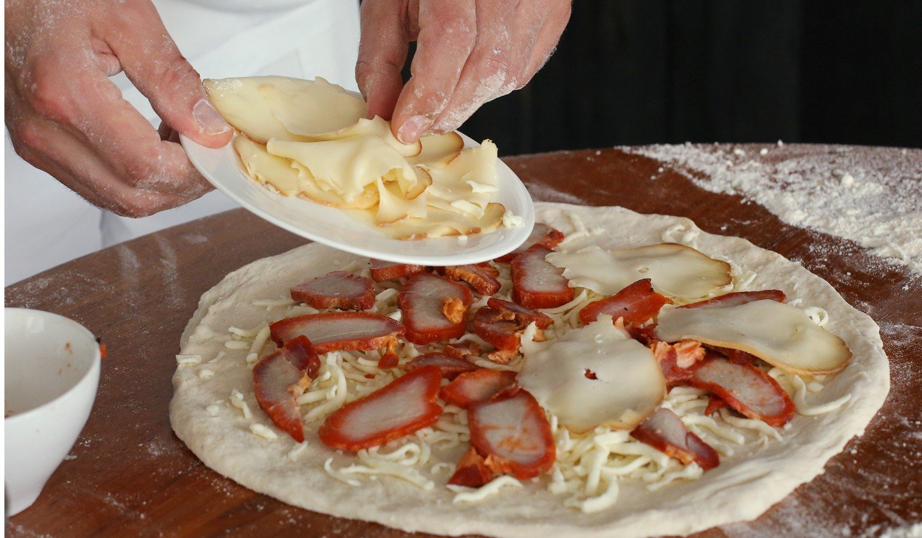 Barbasso puts together his char siu pizza. Photo: Edmond So