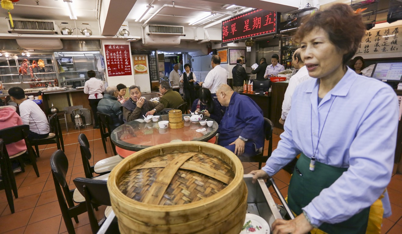 A waitress pushes a cart with food at Lin Heung Kui restaurant in Sheung Wan, where Lauria learned about dim sum. Photo: Jonathan Wong