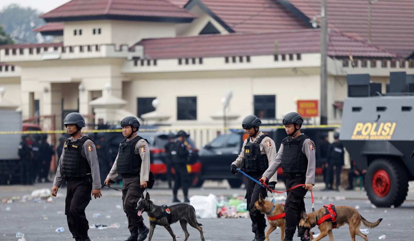Police inside the Mobile Police Brigade (Brimob) headquarters after a hostage crisis at a high-security jail located in the compound was resolved in Depok, south of Jakarta. Photo: Reuters