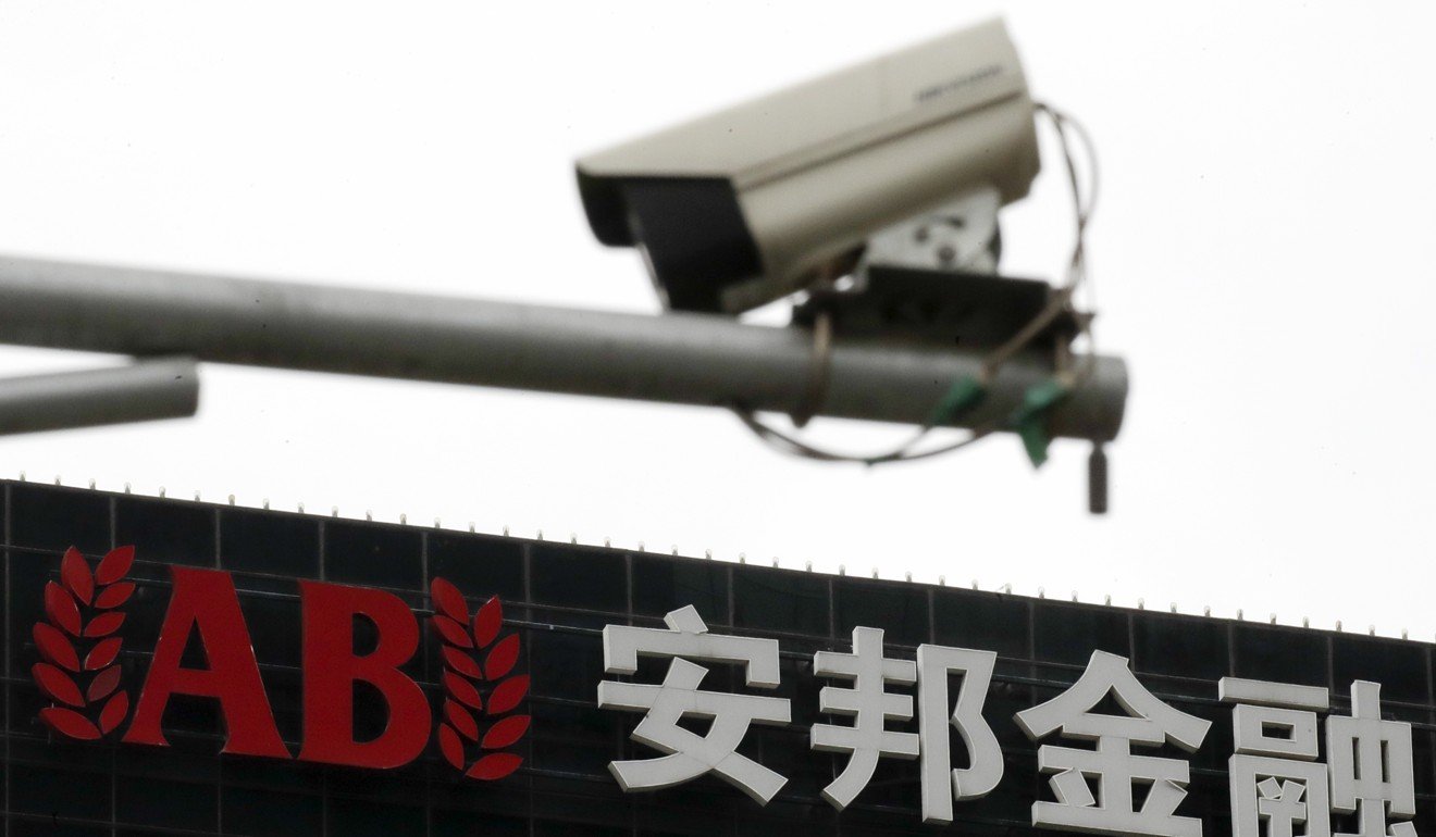 A surveillance camera is seen in front of the Anbang Insurance Group office building in Beijing on April 4. Photo: AP