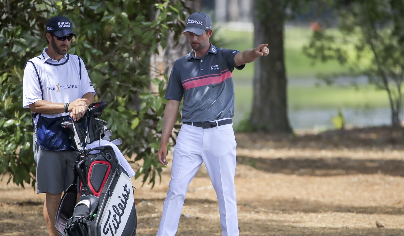 Webb Simpson with his caddie Paul Tesori on the second hole during the third round. Photo: EPA