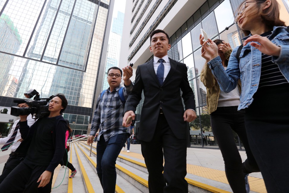 Former Hong Kong Pegasus player Kwok Kin-pong, aged 30, leaves the District Court in Wan Chai on April 19 after being charged charged with match-fixing. Photo: SCMP/Felix Wong