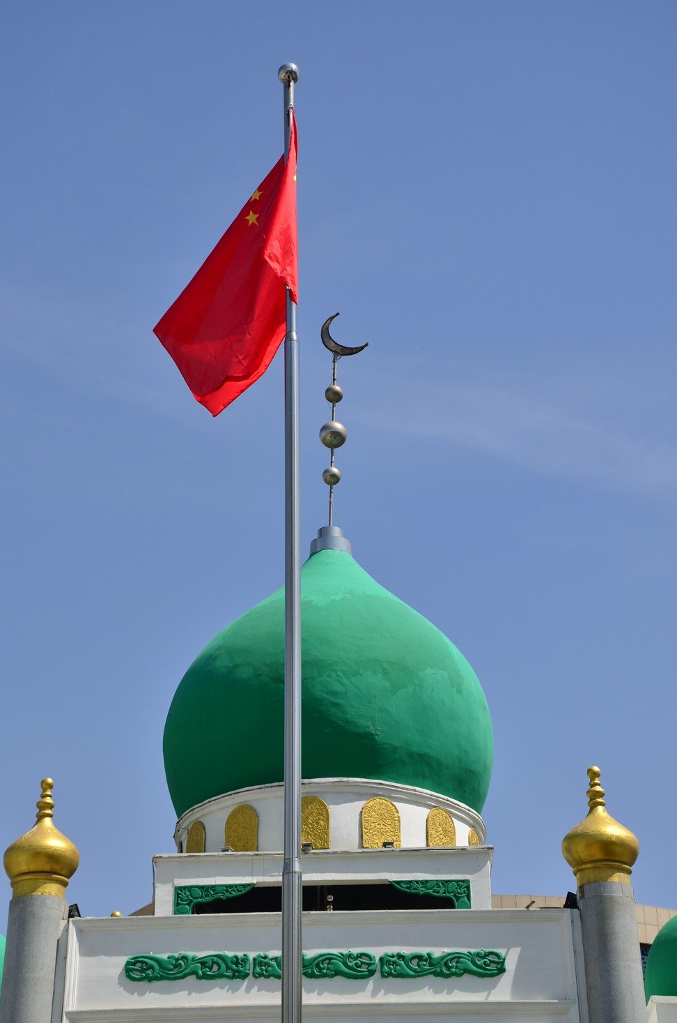 Chinese flags are an increasingly common sight at mosques across China. Photo: Nectar Gan
