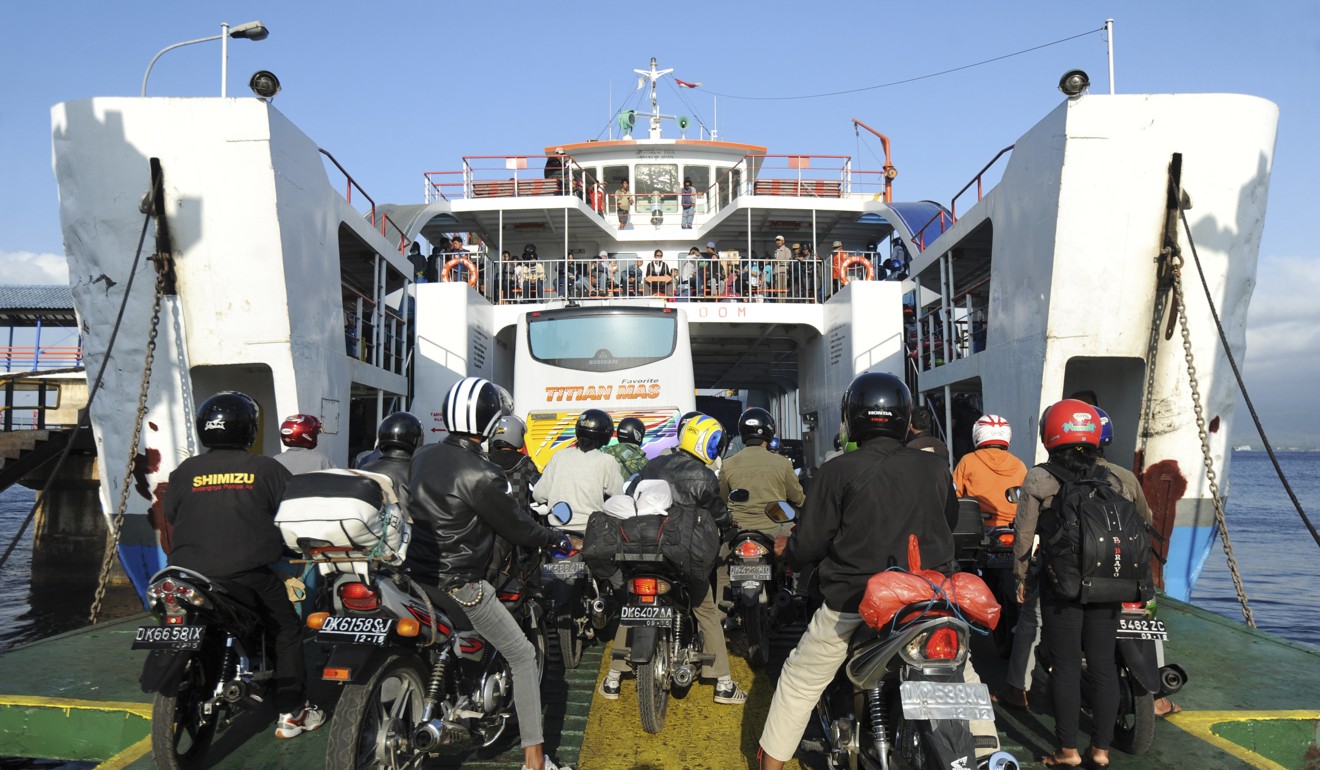 Motorists boarding a ferry headed for Bali’s neighbouring Java. Photo: AFP
