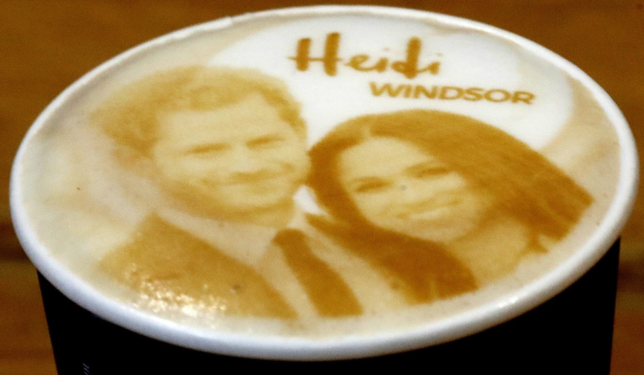 Cups of cappuccino with the picture of Britain's Prince Harry and Meghan Markle on top are pictured at a coffee shop in Windsor, England, on Tuesday. Photo: AP