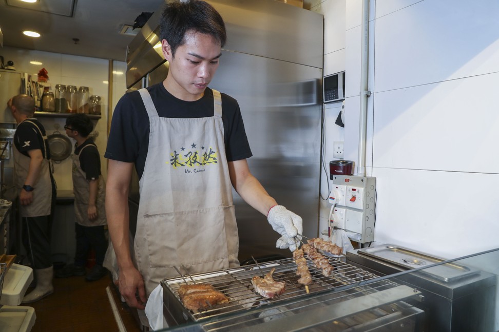 Willie Ling mans the grill at Mr Cumin in Fortress Hill. Photo: K.Y. Cheng
