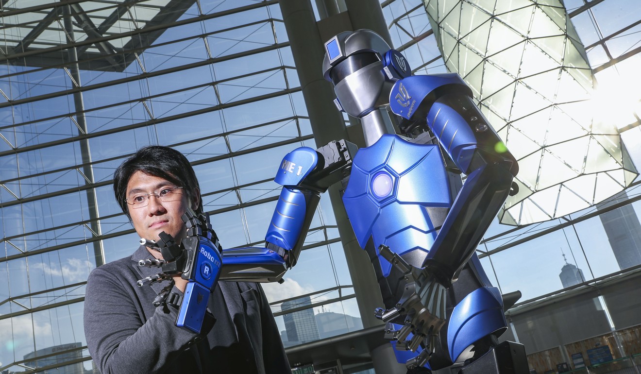 Dr Mark Mak, founder of Roborn Dynamics, with the robot ME1. Photo: K.Y. Cheng