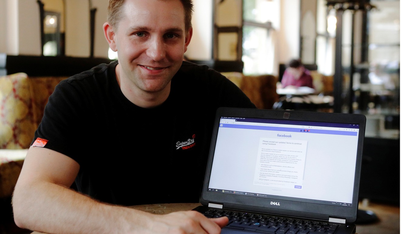 Austrian lawyer and privacy activist Max Schrems displays his Facebook account’s updated terms page. Photo: Reuters