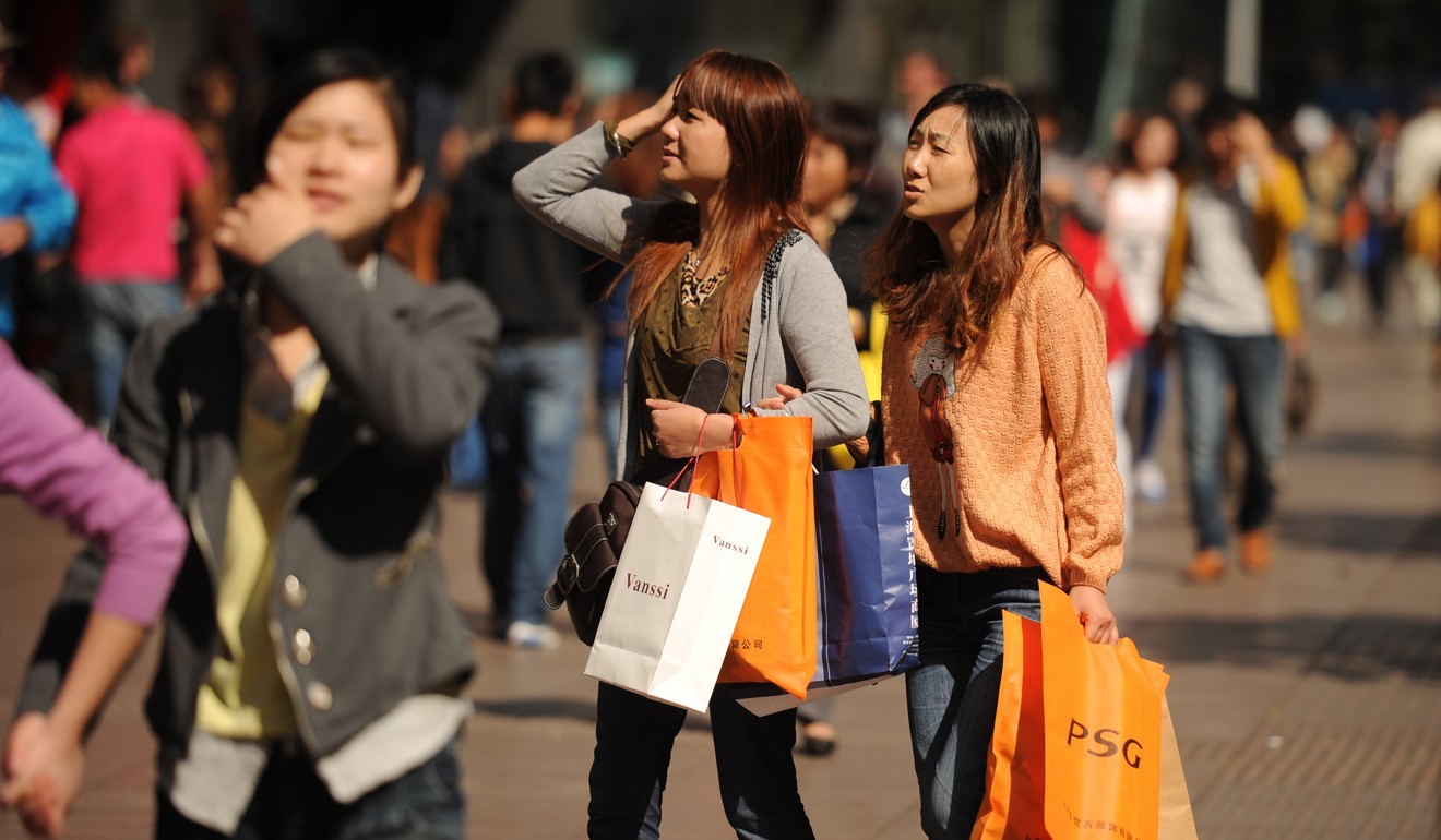 People shop in the financial district of Shanghai in 2012. Photo: AFP