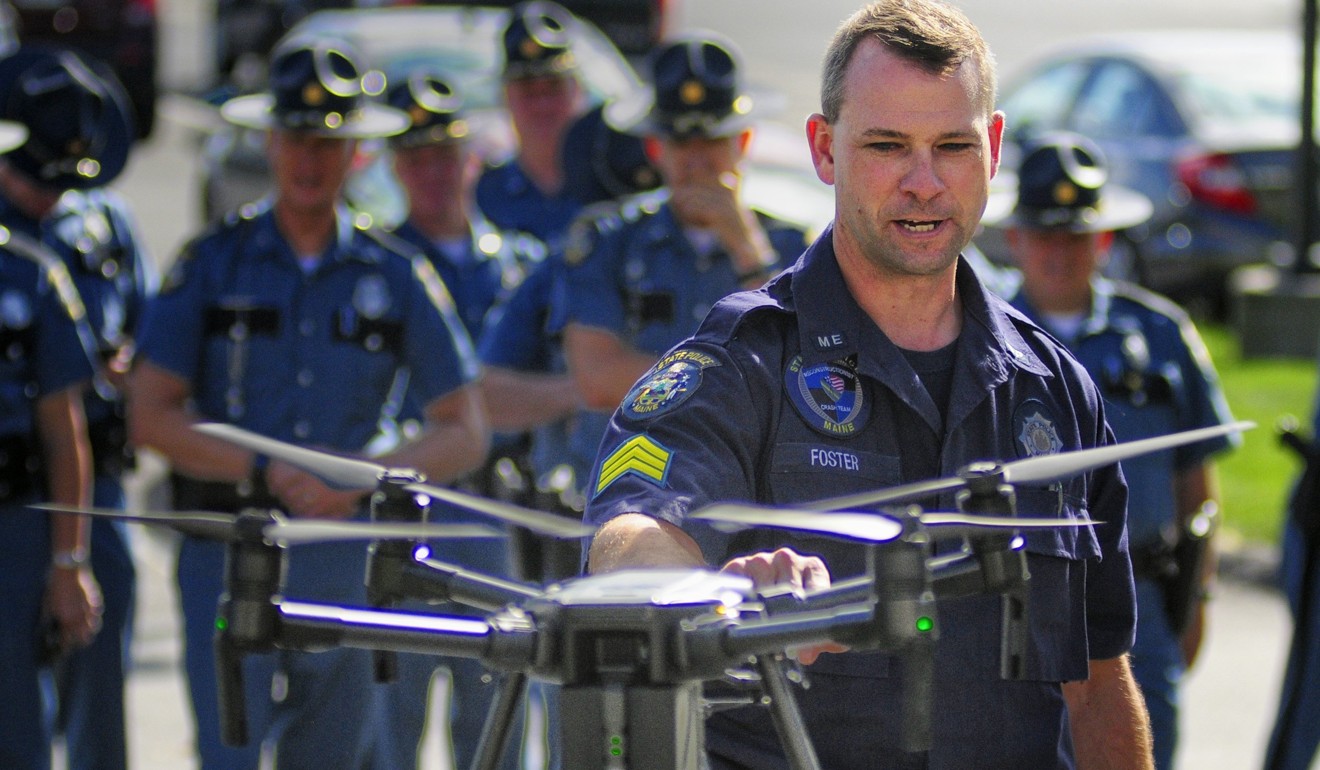 Maine State Police Sergeant Darren Foster discusses the collision avoidance system on an unmanned aerial vehicle used for traffic accident investigations in 2017. Photo: Kennebec Journal via AP