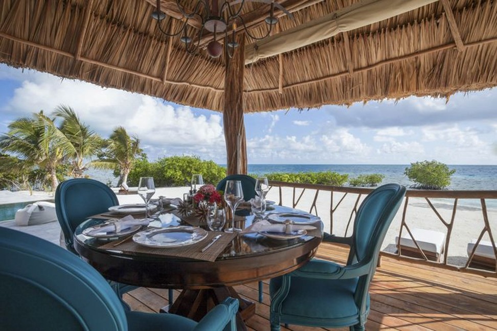 At Gladden Private Island, a tiny hotel off the coast of Belize, everything takes place with a view of the water. Photo: Gladden Private Island