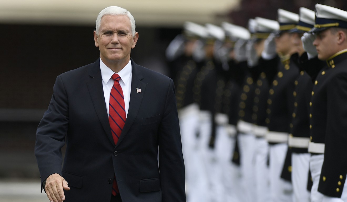 US Vice-President Mike Pence is saluted as he arrives to speak at the commencement for the United States Coast Guard Academy in New London, Connecticut, on Wednesday. Photo: AP