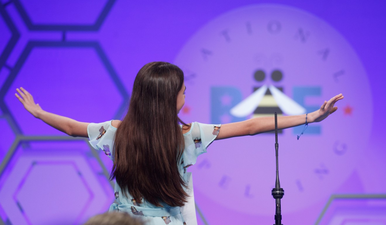 Simone Kaplan, from Miami, Florida, dances off stage after incorrectly spelling carmagnole during the final round of the bee. Photo: EPA