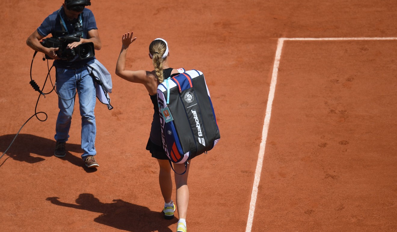Caroline Wozniacki waves to spectators as she leaves the court. Photo: AFP