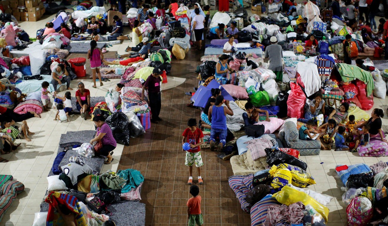 Evacuees rest in a provisional shelter in the local Catholic Church after the eruption of the Fuego volcano. Photo: Reuters