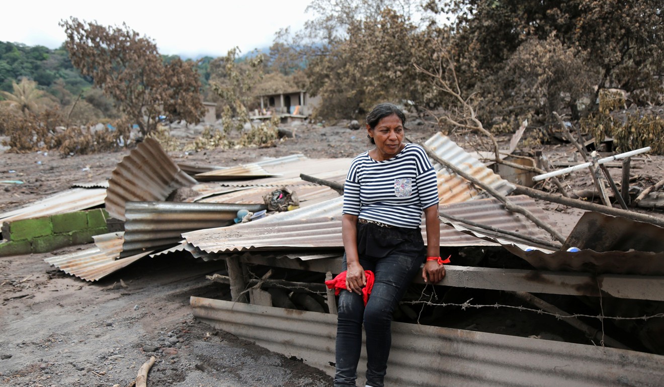 A woman takes a break in an affected area after the eruption of the Fuego volcano. Photo: Reuters