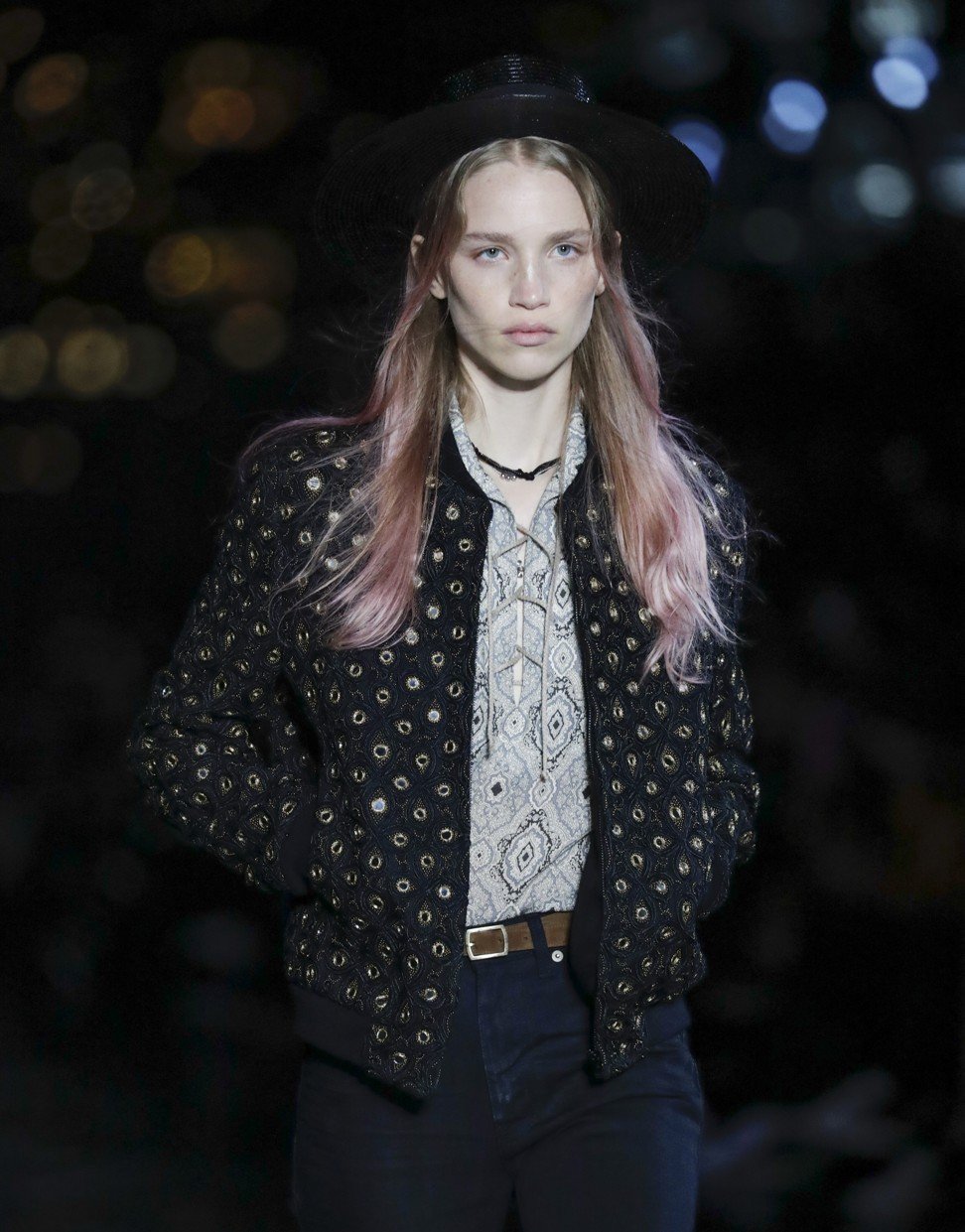 A model displays a creation as part of Yves Saint-Laurent Men