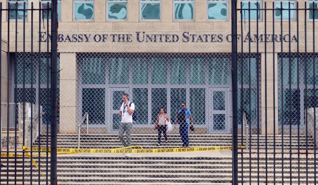 Workers at the US embassy in Havana leave the building on September 29 after the State Department announced that it was withdrawing all but essential personnel from the embassy because Cuba could no longer guarantee diplomats' safety. Photo: Miami Herald/TNS