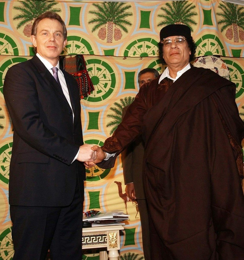 British prime minister Tony Blair and Libyan leader colonel Muammar Gaddafi shake hands ahead of their talks in Tripoli in March 2004. The depiction of world leaders shaking hands for peace are seminal windows in time, but some of these photos have not aged well. Photo: EPA