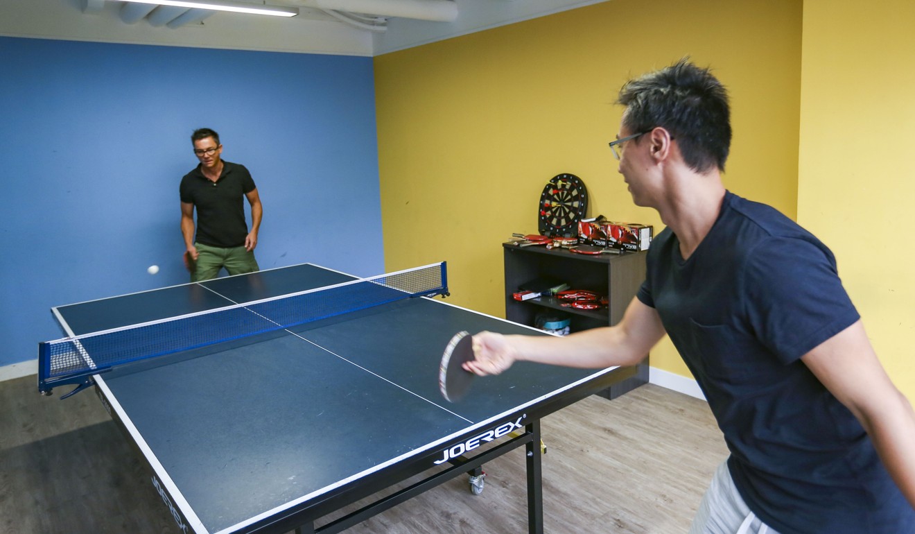 Chengbao employees Eric Pattee (left) and Charles Wong play table tennis. Photo: Xiaomei Chen