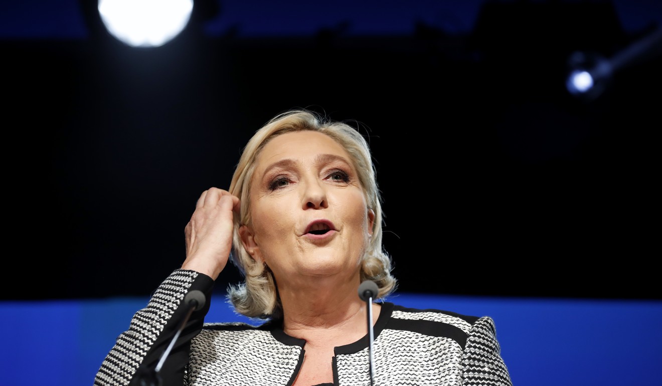 Marine Le Pen delivers a speech to announce changing her party’s name to National Rally, in Bron, France, on June 1. Photo: AP
