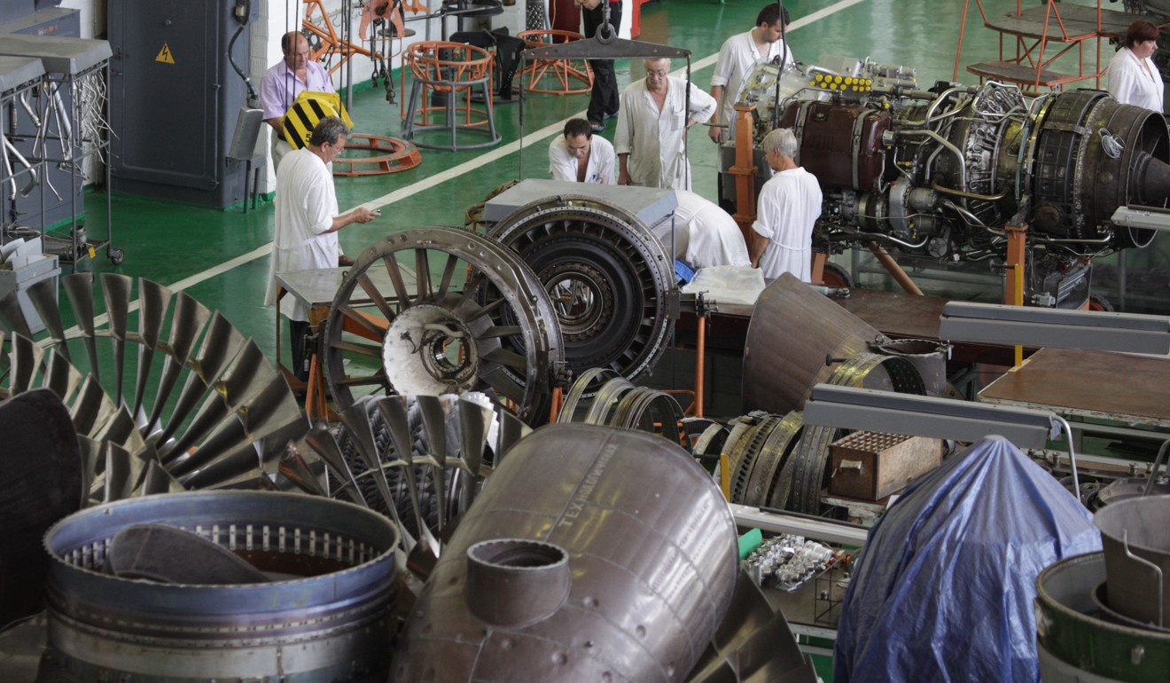 Workers assemble aircraft engines at the Motor Sich Public Joint Stock Company’s plant. Photo: ITAR-TASS