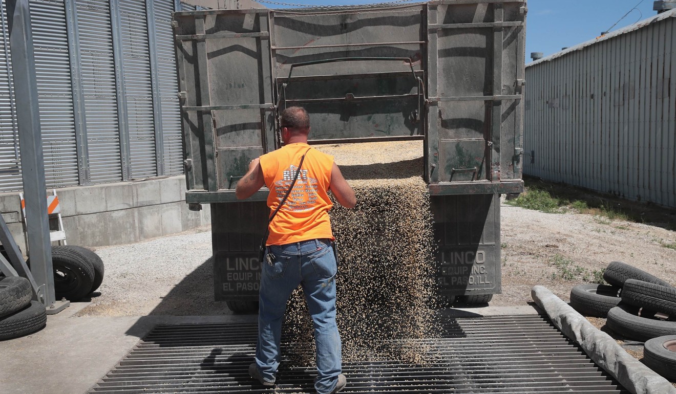 A man unloads soybeans in the US on Wednesday. China’s tariffs will hurt the US soybean industry. Photo: Getty Images via AFP